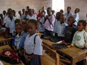 singing the Gambian National Anthem