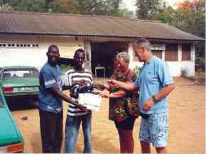 Vic and Jackie handing over the spectacles