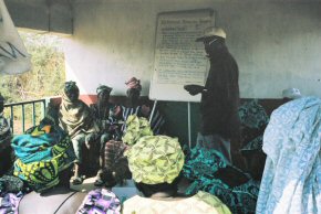 Mr Darboe of NARI talking to villagers