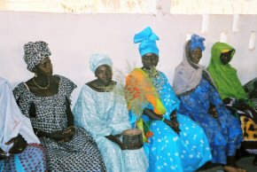 village women with an Artemisia plant