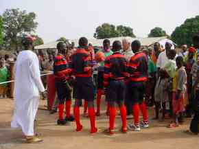 Bakalarr football team members in their new kit chat to Ian