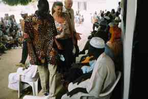 Headmaster, Mr Gitteh, introduce Pippa and Ian to the village elders