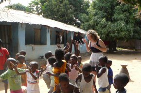 Helen blowing bubbles for the children at Wandifa's compound