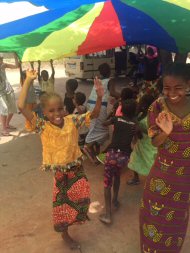 Children enjoying the parachute games