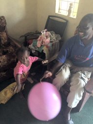 Little Mai playing balloon games with Wandifa