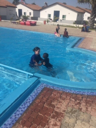 Frances with Alaghie in the pool