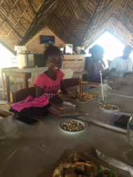 Isha enjoying her yassa and chips!