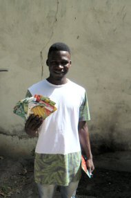 Ebrima with seeds donated from Manor Green Primary School