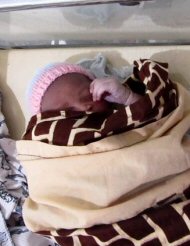 baby with hat at Brikama hospital