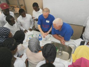 Bob and Andrew demonstrating an experiment