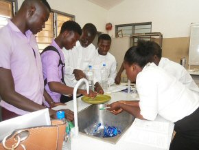 Students examining the effect of soaps and detergents on the surface tension of water