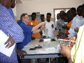 Joe demonstrating hydraulics using syringes