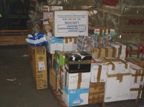 more cardboard boxes and other packages ready to be loaded into a container in the UK