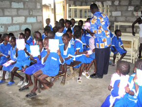 children with their books and pencils