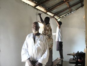 volunteers painting the walls