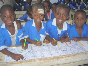 children colouring their poster books (2)