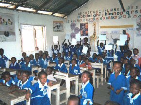 children with their new whiteboards in the classroom