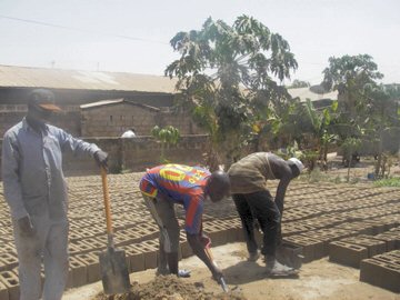 Kira's team of builders making blocks for the new school