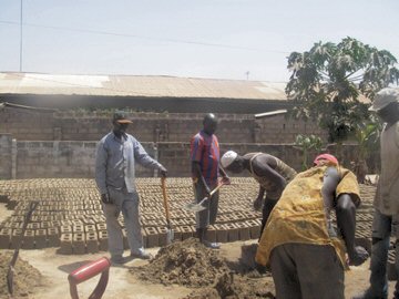 Kira's team of builders making blocks for the new school