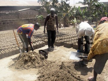 Kira's team of builders making blocks for the new school