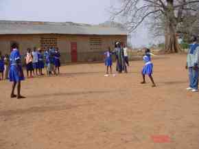 girls playing rounders in blue sports kit provided by Pageant