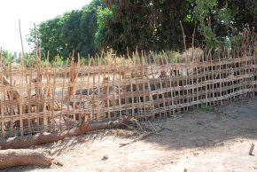 A temporary fence erected round the school garden to keep the goats out