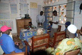 The school Head teacher's room with 4 new chairs, curtains and table cloth