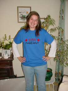 Frances shows the front of the Pageant T-shirt