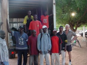 The Pageant unloading team pose at the back of the loaded up lorry