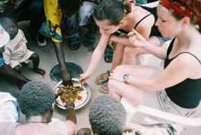 Amanda and Amy sharing a meal with Kemo and his Pageant team