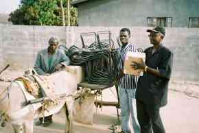 Wandifa with a donkey cart loaded with chairs and other goods