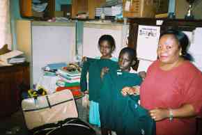 jumpers and cardigans being unpacked at Wesley School