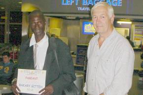 Ian Howard meeting Mr Bakary Gitteh at Gatwick Airport