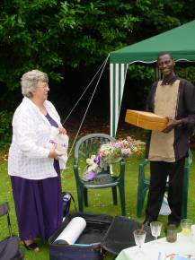 Diana gives Bakary some presents