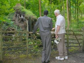 Bakary and Ian look at a charcoal burner's hut at Singleton