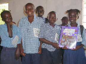 Abuko children  with the folder from Ridgemead Junior School