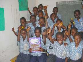 Abuko children  with the folder from Ridgemead Junior School