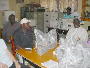 unpacking microscopes at Gambia SSS