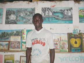 Ousman with some of his latest paintings