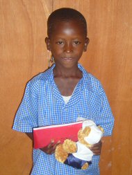 Alfusainey with a new teddy and his Pageant pencil case