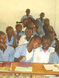 a group of children sitting at their new desks