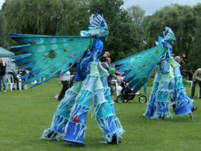 stilt walkers leading the parade