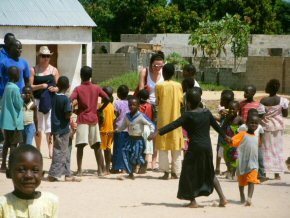 Gemma and Sarah surrounded by children