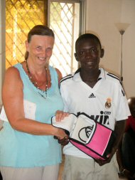 Modou Jeng gets his prize from Pippa