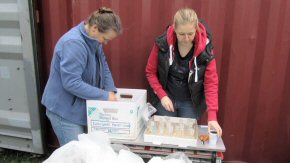 Fiona and Natasha packing laboratory glassware