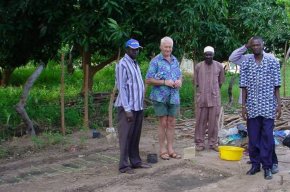 Ian looks at the plot after the new wall was erected, and cultivation is beginning