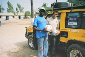 Chris & Kemo with two of the many footballs