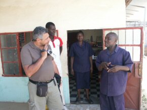 Hany talking to headmaster Jacob Amadi