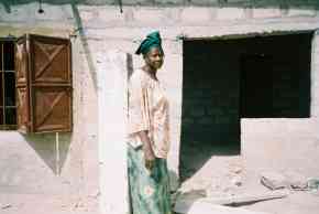 Saloum headmistress outside the new building