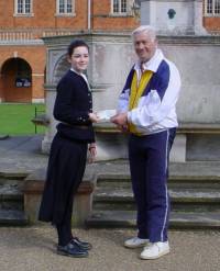 Emma Topolski presents a cheque to Ian Howard